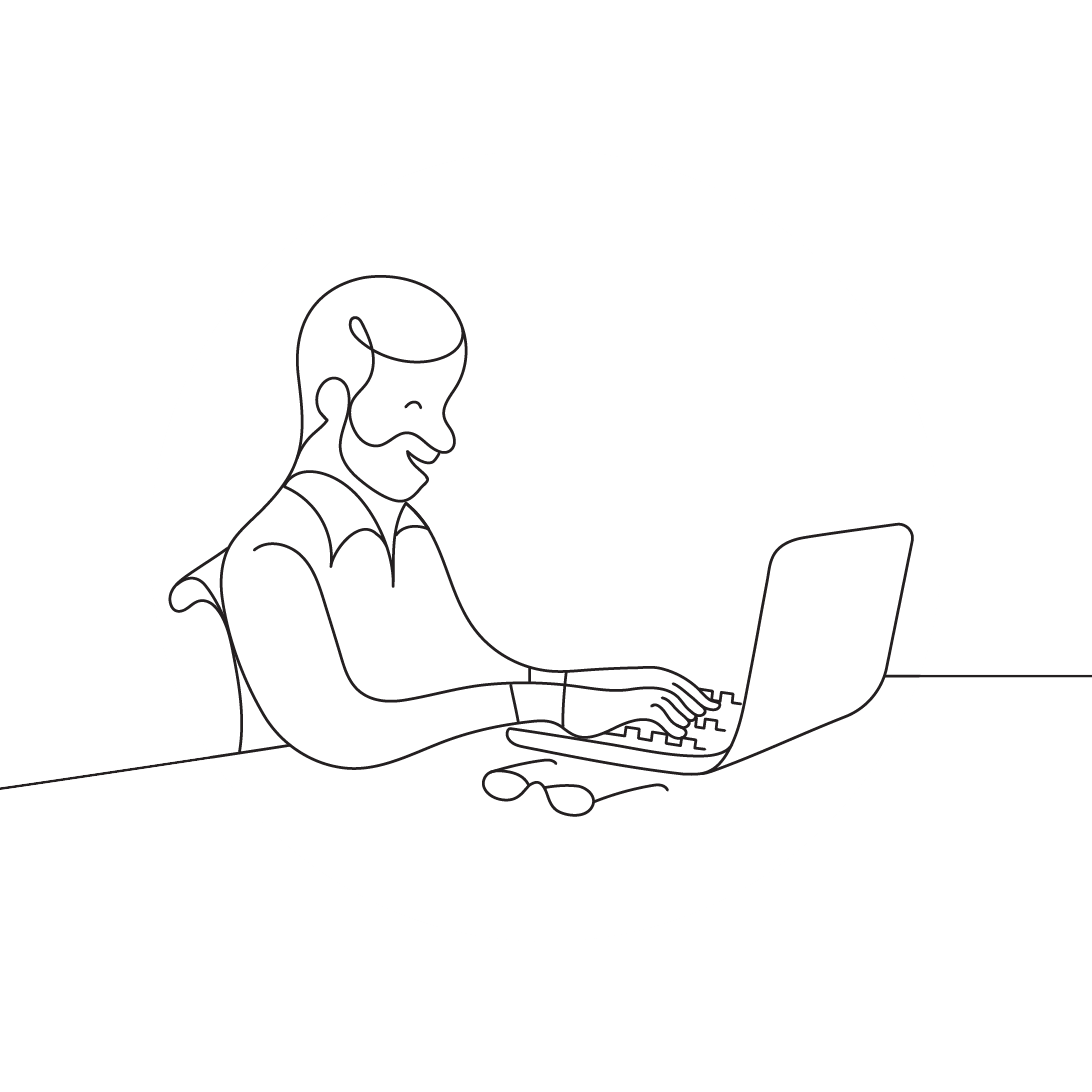 A man sitting at a desk using a laptop white.
